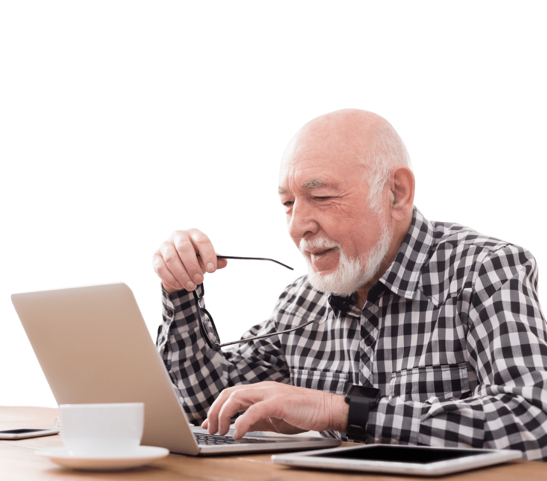retiree studying on a laptop