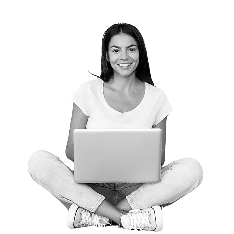 Woman sitting down studying on laptop